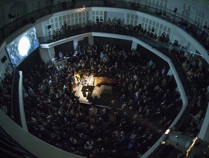 People at an event in the Kuppelhalle at Silent Green in Berlin.
