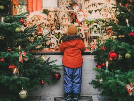 Little boy  standing near Christmas tree in Rothenburg