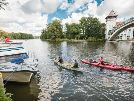With canoe and kayak on the Spree at the Abteibrücke in Berlin Treptow
