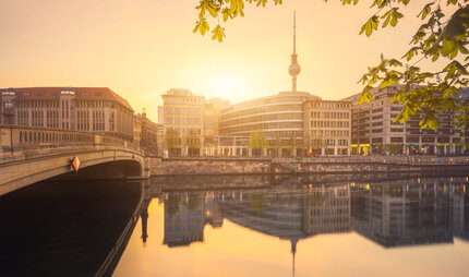 Berlin City Summer Skyline with Spree River Reflection and Sunlight