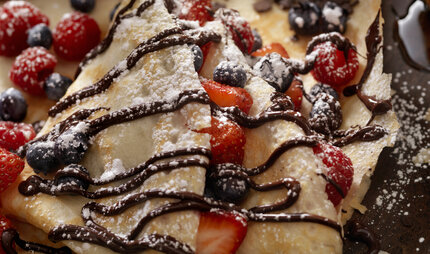 Crepes with Fresh Berries, Chocolate Sauce and Powdered sugar