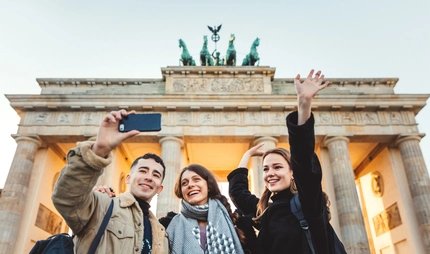 Friends at Brandeburg Gate in Berlin take a selfie