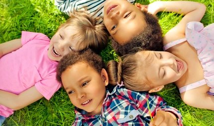 High angle view of children lying in a park