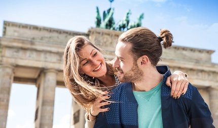 Beautiful couple celebrating in Berlin - Brandenburg Gate