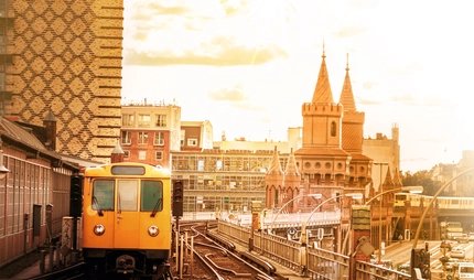 yellow berlin metro train arriving at Station Oberbaumbrücke