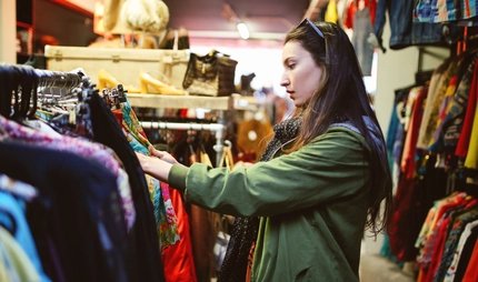 A girl is shopping vintage and second hand clothes