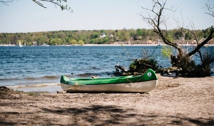 View of the Wannsee with kayak on the beach on the Wannsee-Babelsberg route View of the Wannsee with kayak on the beach on the Wannsee-Babelsberg route